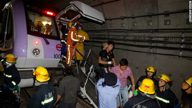 Rescuers evacuate passengers after the subway train collision on September 27.