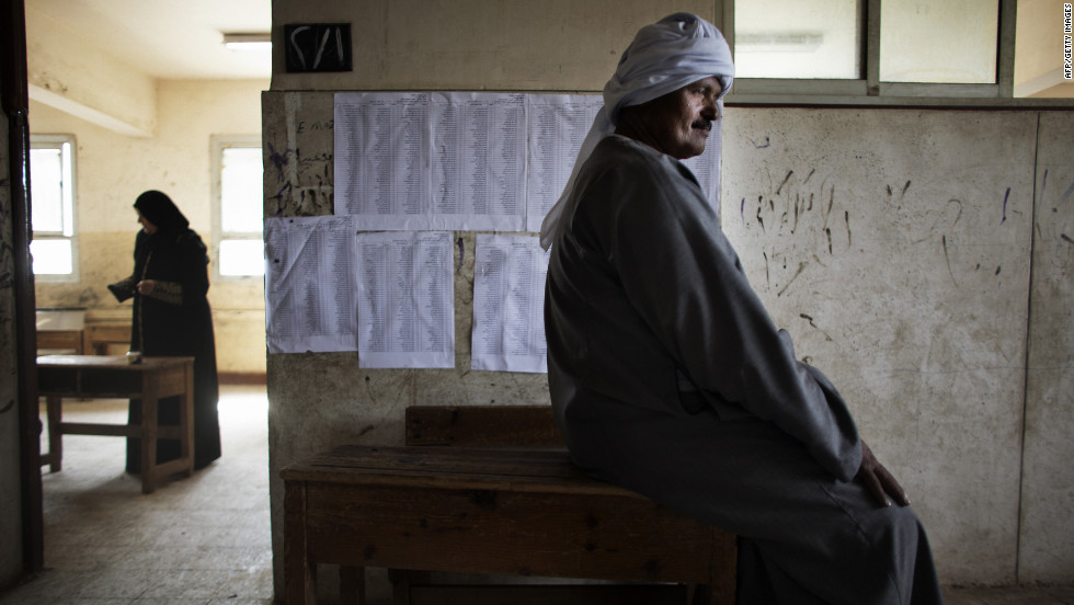 An Egyptian man waits to cast his ballot Thursday north of Cairo. The vote is considered Egypt&#39;s first free and fair presidential election in modern history. 