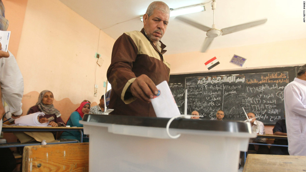 An Egyptian man drops off his ballot at a polling station Thursday in Cairo. The voting marks the first time Egypt has held a presidential election in which the results aren&#39;t known beforehand.
