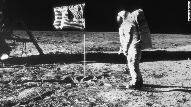   July 1969: American astronaut Edwin &#39;Buzz&#39; Aldrin on the surface of the moon next to the American flag during the NASA Apollo 11 mission. Prints from Aldrin&#39;s spaceboots mark the lunar terrain. Aldrin was the second man to walk on the moon, after Neil Armstrong. (Photo by Hulton Archive/Getty Images)  