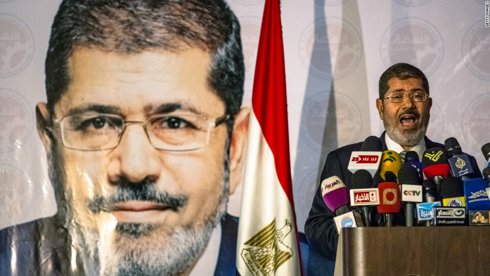 The Muslim Brotherhood on Sunday claims its candidate, Mohamed Morsi, has defeated foe Ahmed Shafik to become Egypt&#39;s president. 