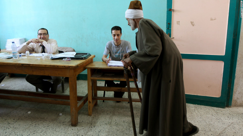 An elderly Egyptian man registers Saturday before voting in the city of Zagazig in an election that pits Ahmed Shafik, the last premier of ousted President Hosni Mubarak, against Muslim Brotherhood candidate Mohammed Morsi.