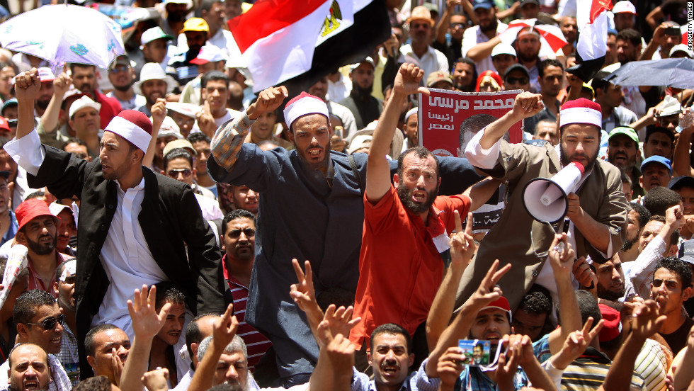 Muslim clerics join demonstrators in Cairo&#39;s Tahrir Square on Thursday to protest the delay of the presidential election results. The Presidential Election Commission postponed the release of the presidential election results, and both candidates have declared themselves winners.