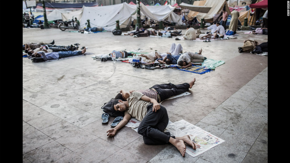 Protesters sleep as they camp overnight in Tahrir Square.