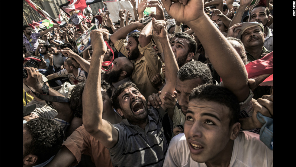 Egyptians celebrate the election of Morsi after he won 51% of the vote to defeat Shafik.