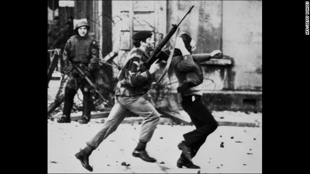 LONDONDERRY, UNITED KINGDOM - JANUARY30:  A British soldier drags a Catholic protester during the &quot;Bloody Sunday&quot; killings 30 January 1972 when British paratroopers shot dead 13 Catholics civil rights marchers in Londonderry. Shortly after, the Irish Republican Army (IRA) declared that their immediate policy was &quot;to kill as many British soldiers as possible&quot;. Since the partition of Ireland in 1921, the IRA has fought for a complete withdrawal of British troops from Northern Ireland and a reunification of the island of Ireland. But it was in 1969, when civil rights marches flared into violence, that the old IRA split and the Provisional IRA was born. Around 3,500 people have died and almost 40,000 have been injured in sectarian violence involving the IRA and pro-British-rule unionist paramilitaries--the so-called loyalists.  (Photo credit should read THOPSON/AFP/Getty Images)