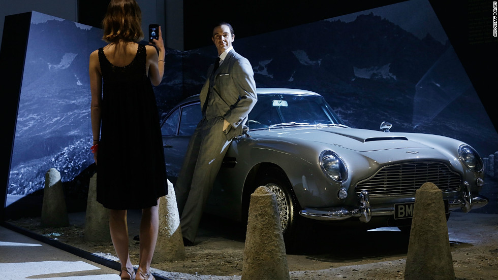  A Sean Connery waxwork and the famous Aston Martin DB5 greets fans outside the exhibition.