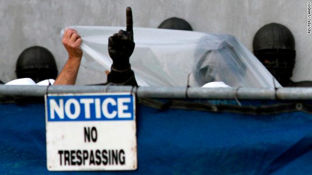 Workers prepare to remove the statue of Penn State football coach Joe Paterno in 2012 in the wake of the Sandusky abuse scandal.