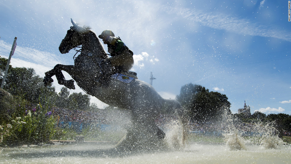 Jamaica's Samantha Albert, riding Carraig Dubh, competes in the cross country phase of the eventing competition.