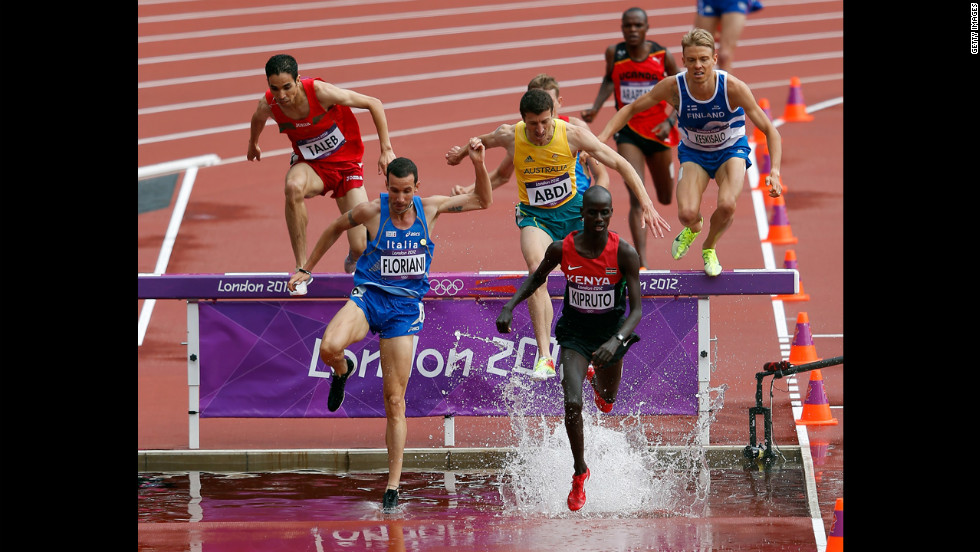 Italy's Yuri Floriani, left, and Kenya's Brimin Kiprop Kipruto compete in the men's 3,000-meter steeplechase.