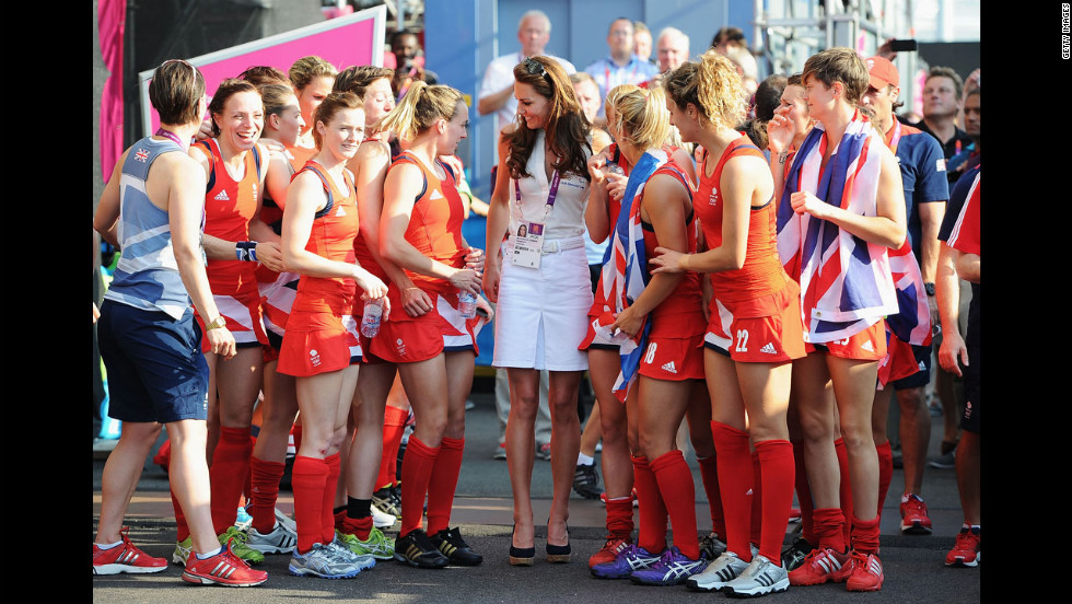 Catherine, Duchess of Cambridge, center, talks to Great Britain's field hockey team members after they won the bronze medal against New Zealand.