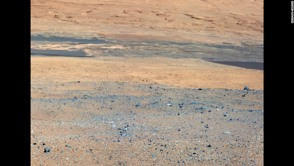 This image, taken from the rover&#39;s mast camera, looks south of the landing site toward &quot;Mount Sharp.&quot; 