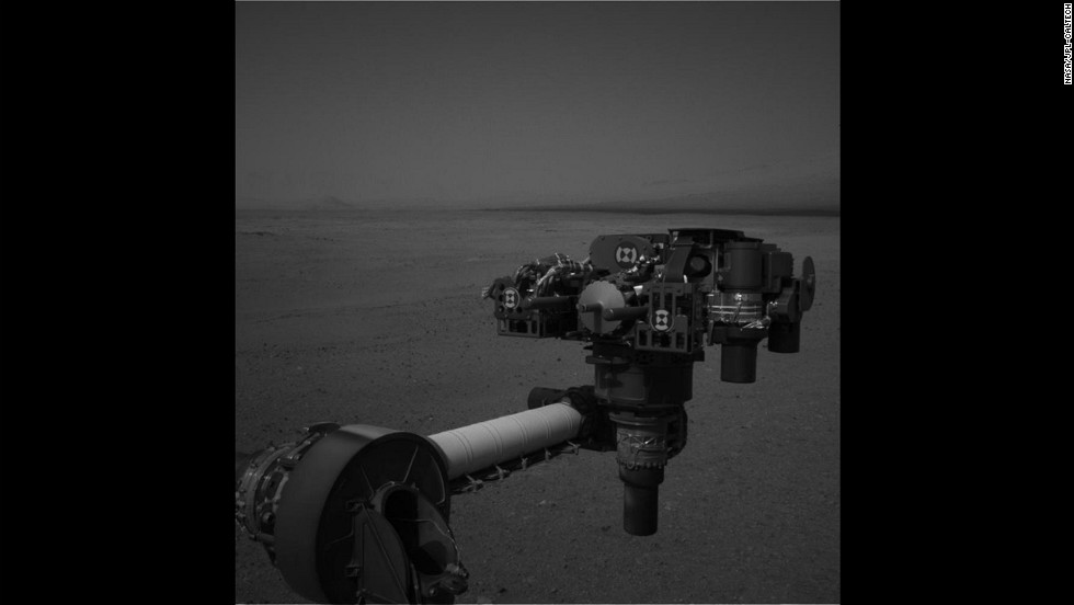 Curiosity moved its robot arm on August 20, 2012, for the first time since it landed on Mars. &quot;It worked just as we planned,&quot; said JPL engineer Louise Jandura in a NASA press release. This picture shows the 7-foot-long arm holding a camera, a drill, a spectrometer, a scoop and other tools. The arm will undergo weeks of tests before it starts digging.