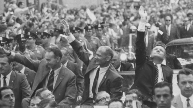 Apollo 11 astronauts Neil Armstrong, Buzz Aldrin and Michael Collins addressing the crowd at a parade celebrating their return from the moon. 