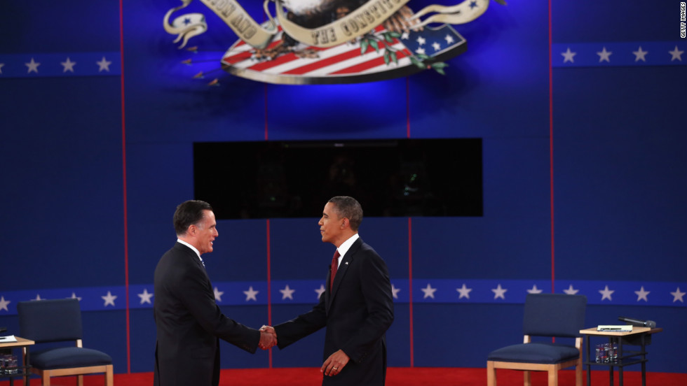 Republican presidential candidate Mitt Romney and U.S. President Barack Obama greet each other on stage.