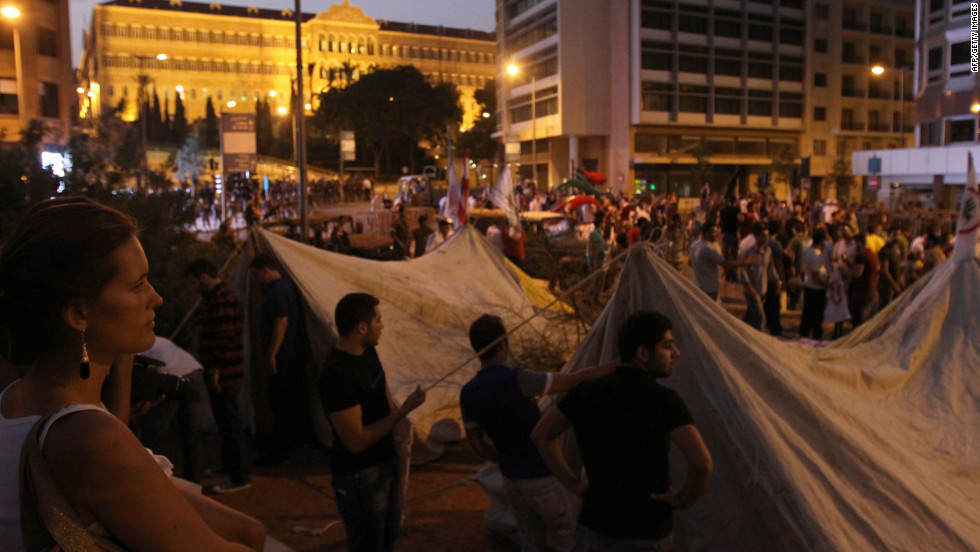 People set up tents and gather outside the headquarters of the Prime Minister of Lebanonon on Saturday night.