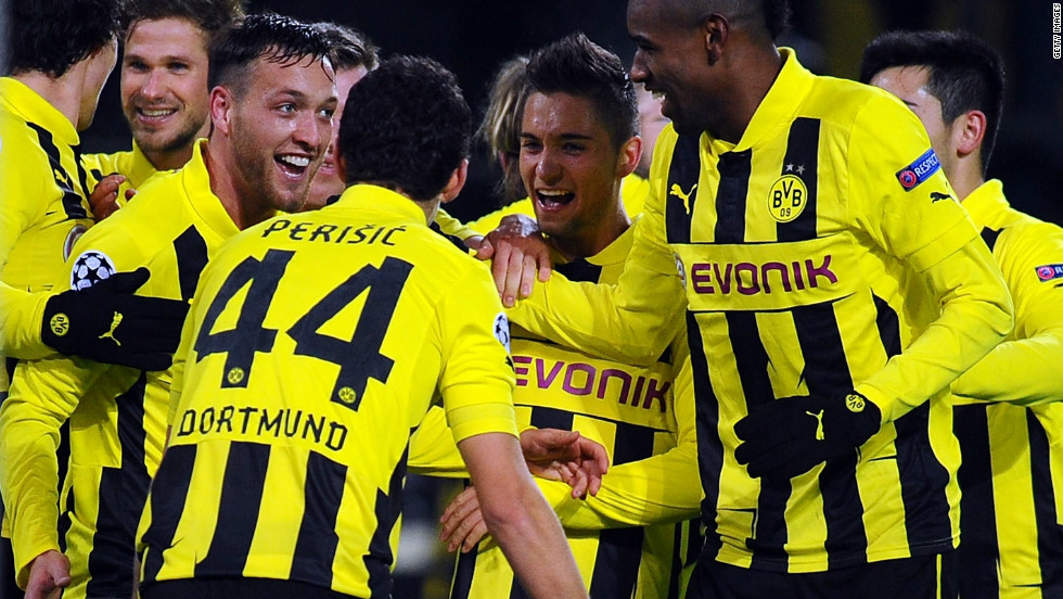 Borussia Dortmund&#39;s Julian Schieber celebrates his winner against Manchester City as his team secures top spot in Group D. The Germans finished one point ahead of Real Madrid and will be relishing the knockout phase.