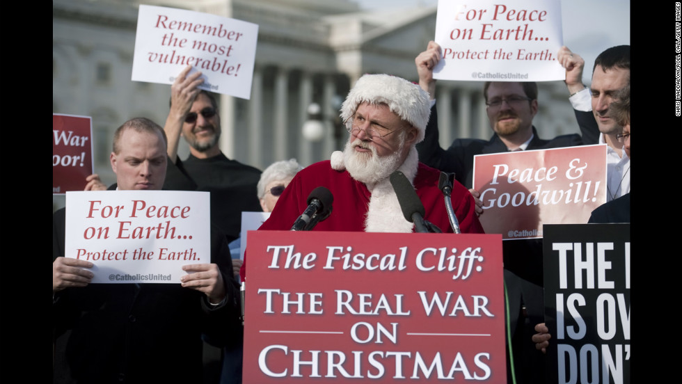 Catholics United hold a press conference with Santa Claus in front of the U.S. Capitol to rebut the GOP's budget effort in the ongoing fiscal cliff argument on December 12 in Washington.