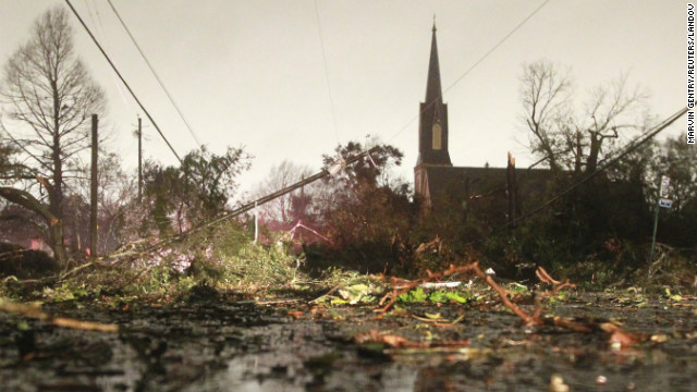 Downed trees and power lines caused by a Christmas Day tornado are seen along Dauphin Street in Mobile, Alabama December 25, 2012. The National Weather Service said a tornado struck Mobile, a U.S. city with a population of about 200,000, at about 5 p.m. local time (2300 GMT). There were reports of damage to trees and widespread power outages, along with some structural damage.