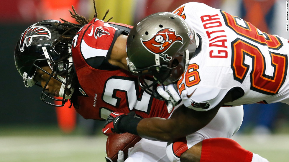 Anthony Gaitor of the Tampa Bay Buccaneers tackles Jacquizz Rodgers of the Atlanta Falcons at the Georgia Dome in Atlanta on Sunday.