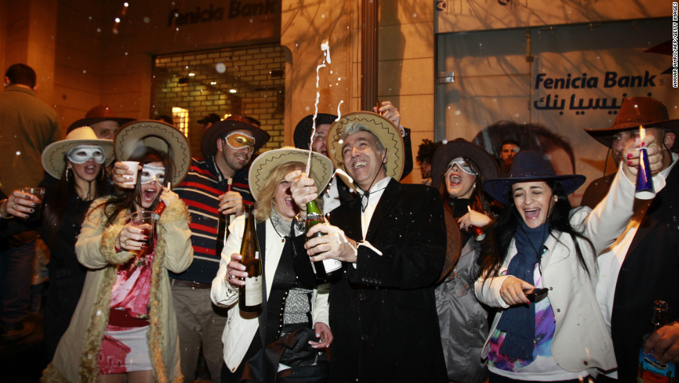 Partiers in Beirut, Lebanon, celebrate the new year early Tuesday.