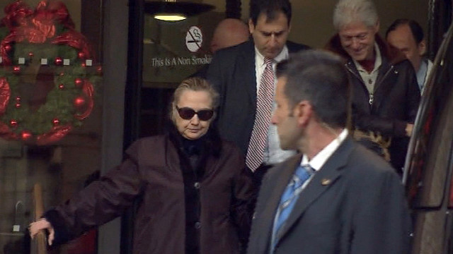 Secretary of State Hillary Clinton exits the hospital and boards a waiting van on Wednesday, January 2.