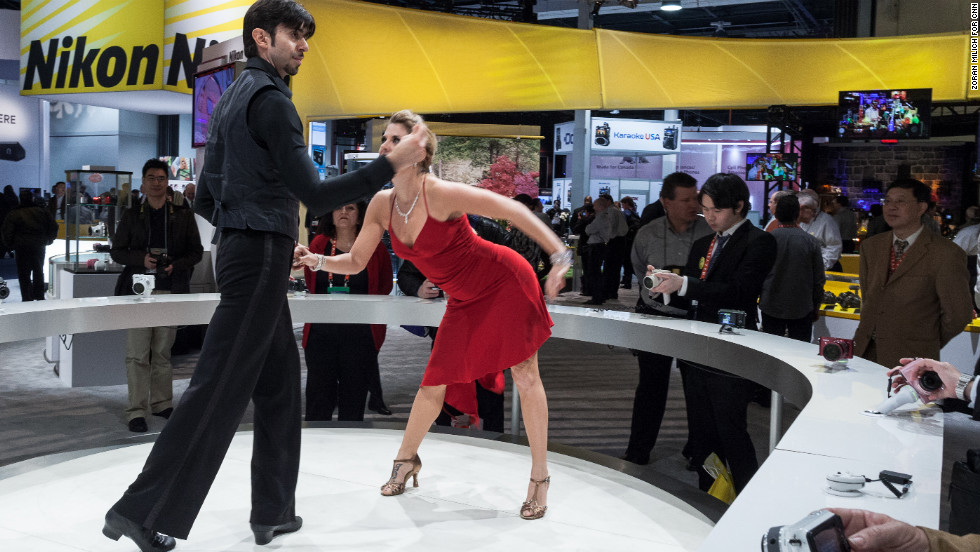 People who wanted to demo Nikon's new cameras Tuesday could snap photos of these dancers at the Nikon booth.