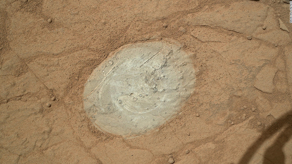 Curiosity used a dust-removal tool for the first time to clean this patch of rock on the Martian surface on January 6, 2013.