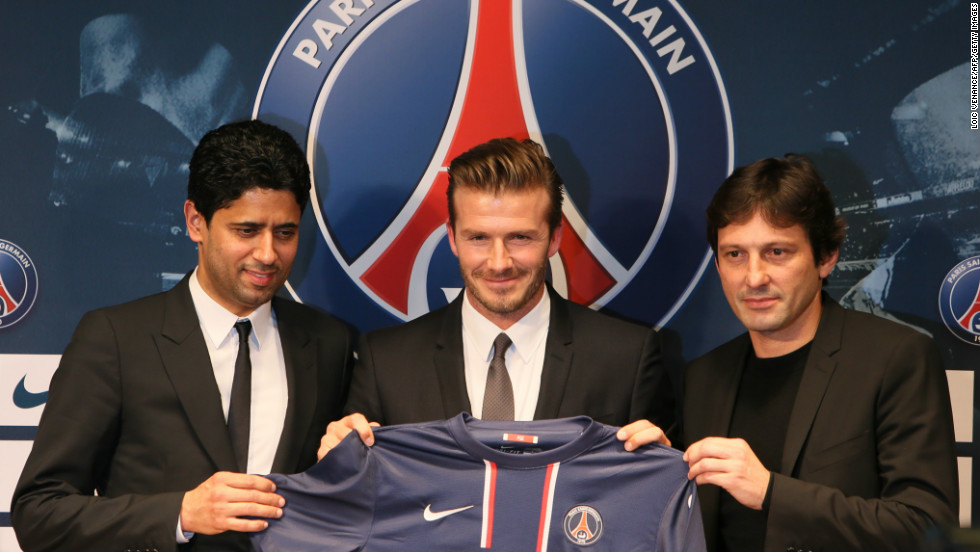 Beckham poses with Paris Saint-Germain President Nasser Al-Khelaifi, left, and PSG sports director Leonardo during a news conference announcing his new gig in January 2013.