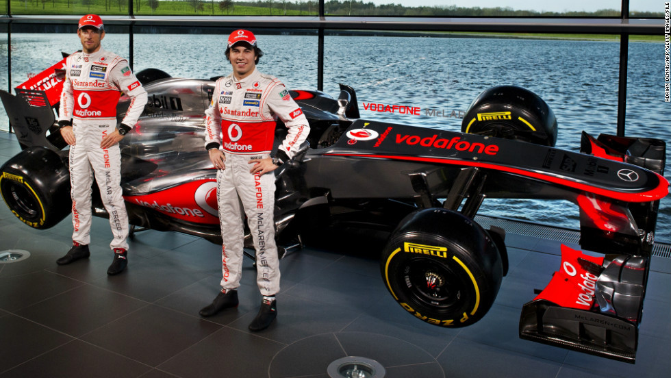 British team McLaren unveiled its car on January 31. New driver Sergio Perez (right) poses with 2009 world champion Jenson Button and the new MP4-28.