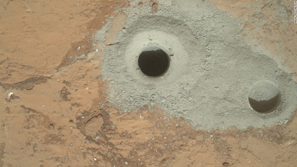 The rover drilled this hole, in a rock that&#39;s part of a flat outcrop researchers named &quot;John Klein,&quot; during its first sample drilling on February 8, 2013.