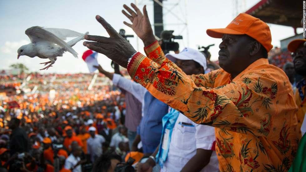 Kenyan Prime Minister and presidential candidate Raila Odinga releases a dove at a rally in Nyayo Stadium in Nairobi on March 2, 2013, on the last day of campaigning, 48 hours ahead of presidential, gubernatorial and senatorial elections.