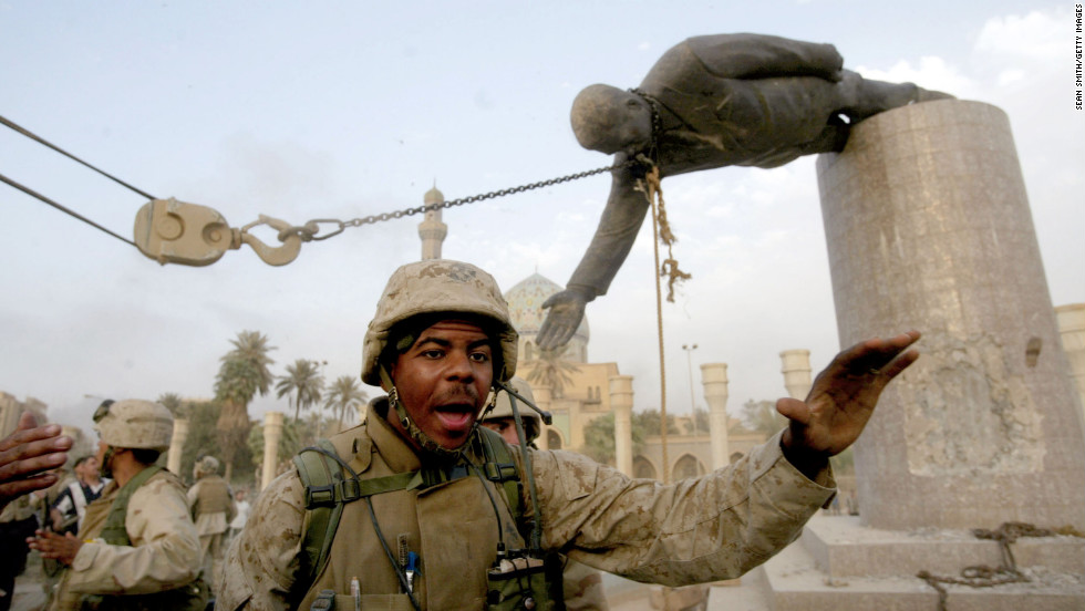 Marines pull down a statue of Saddam Hussein, a symbolic finale to the fall of Baghdad, on April 9, 2003.