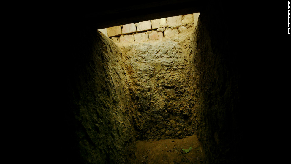 The entrance to the &quot;spider hole&quot; where Saddam Hussein was hiding in Ad Dawr is seen from the inside on December 15, 2003.