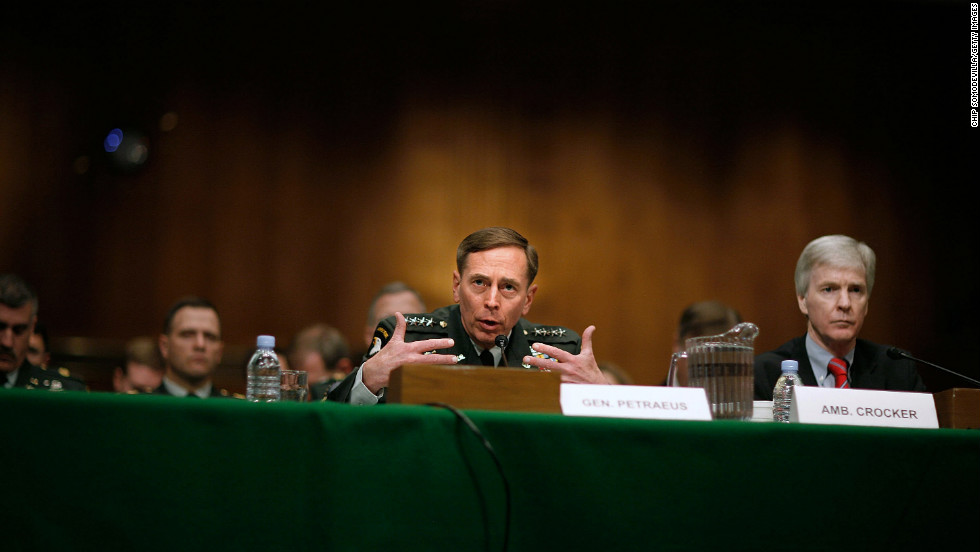 Commanding Gen. David Petraeus, center, and Ambassador Ryan Crocker testify before the Senate Armed Services Committee in Washington on April 8, 2008. In reporting on the success of the surge in Iraq, Petraeus said the number of U.S. troops in the country should not drop below 140,000.