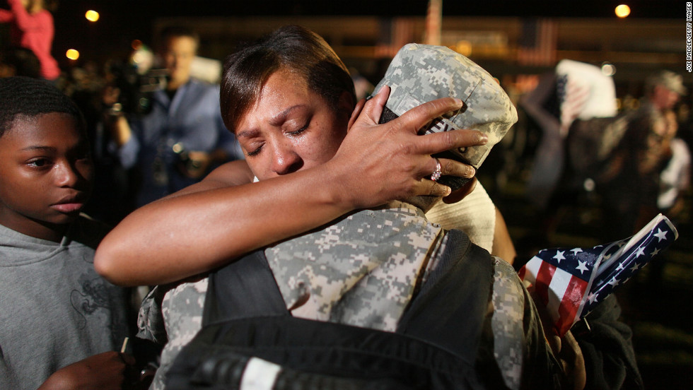 Army Sgt. Donald Lewis from the 1st Cavalry Division is greeted by his wife, Nicole Lewis, after his brigade arrived home in Fort Hood, Texas, on November 10, 2009, after a year of deployment in Iraq.