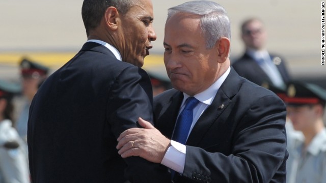 US President Barack Obama (L) hugs Israel's Prime Minister Benjamin Netanyahu (R) during a welcome ceremony at Ben Gurion International Airport on March 20, 2013 near Tel Aviv. Obama landed in Israel for the first time as US president, on a mission to ease past tensions with his hosts and hoping to paper over differences on handling Iran's nuclear threat. AFP PHOTO/MANDEL NGAN (Photo credit should read MANDEL NGAN/AFP/Getty Images) 