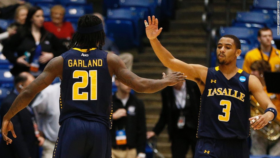 Tyrone Garland and Tyreek Duren of the La Salle Explorers celebrate after defeating the Boise State Broncos 80-71 during the First Four round of the NCAA tournament on Wednesday, March 20, in Dayton, Ohio. Check back to follow the action and see the results as March Madness unfolds.