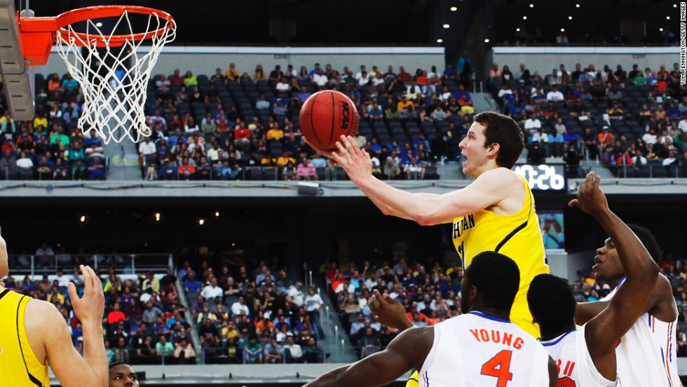 Nik Stauskas of Michigan shoots over Florida on March 31.