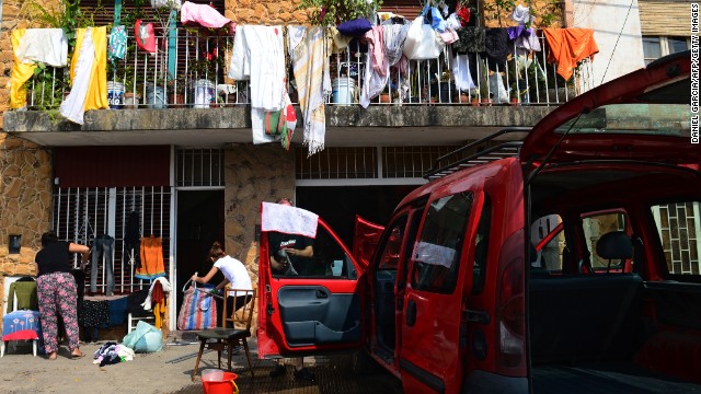 People affected by the storm and resulting floods in La Plata put their clothes and other belongings out in the sun to dry on April 4.