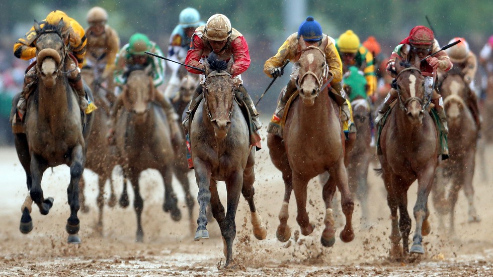 Joel Rosario riding Orb, center, comes down the final stretch.