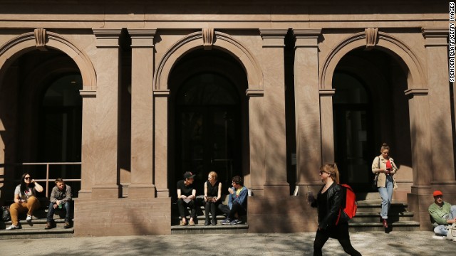  NEW YORK, NY - APRIL 24: Students sit in front of Cooper Union for the Advancement of Science and Art, one of the last tuition-free colleges in the country, on April 24, 2013 in New York City. Cooper Union recently announced that for the first time in more than a century it will begin charging undergraduates to attend the school starting in the fall of 2014. While the school will not charge students in severe financial hardship, those that can will pay around $20,000 per year. (Photo by Spencer Platt/Getty Images) 