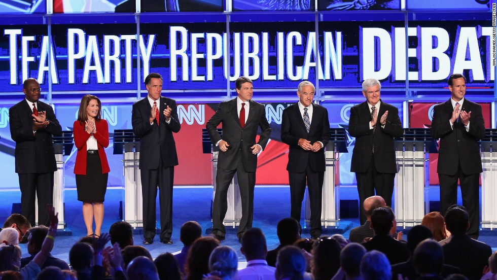 From left, Republican presidential candidates Herman Cain, Bachmann, Mitt Romney, Texas Gov. Rick Perry, Rep. Ron Paul, former House Speaker Newt Gingrich and Rick Santorum participate in a September 2011 presidential debate sponsored by CNN and the Tea Party Express in Tampa, Florida. 