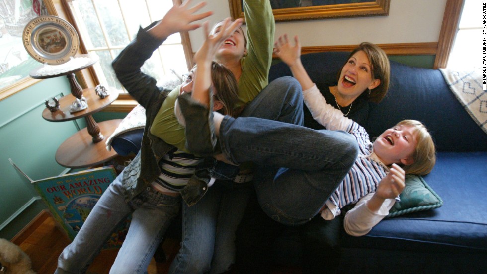 Bachmann plays with daughters, from left, Caroline, Elisa and Sophia at their home in Stillwater, Minnesota, in December 2004.
