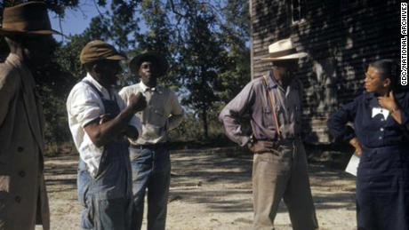 Human test subjects from the Tuskegee syphilis study talking with a study coordinator, Nurse Eunice Rivers, in 1970.