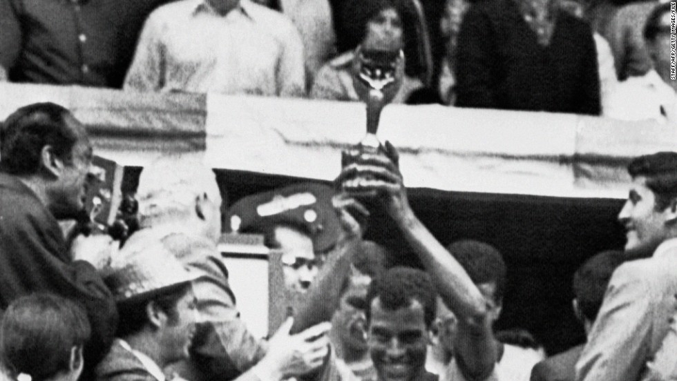 Carlos Alberto, captain of the 1970 team, lifts the Jules Rimet trophy which Brazil was allowed to keep after becoming the first nation to win the World Cup three times. The former fullback thinks next year's World Cup will come too soon for Brazil's inexperienced team.
