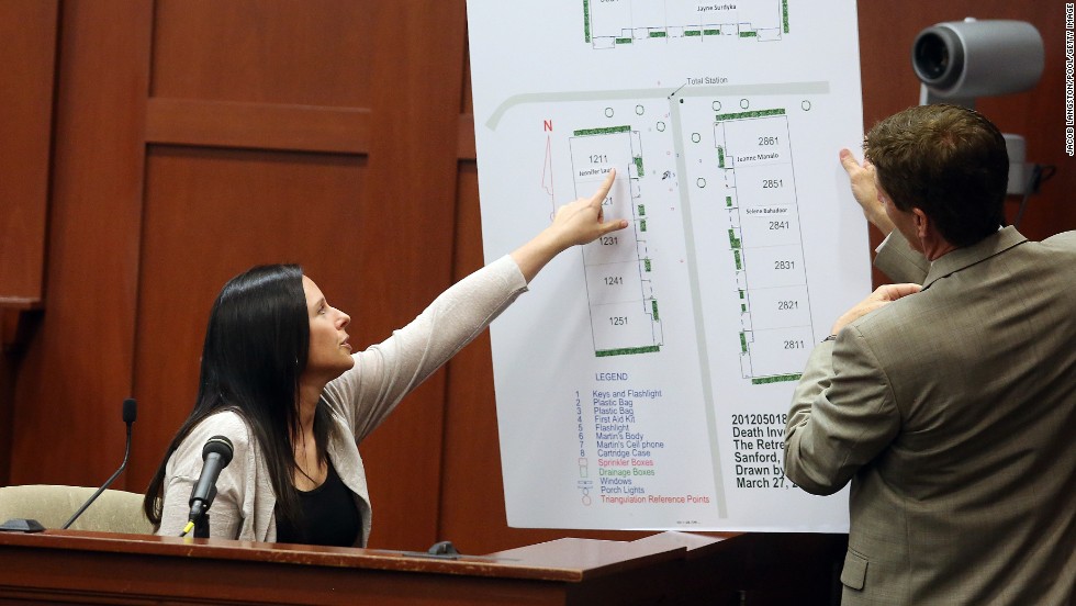 Witness Jennifer Lauer points to where her former home was in the Retreat at Twin Lakes community during questioning by defense attorney Mark O&#39;Mara on June 27. Lauer called 911 on the night of the shooting.