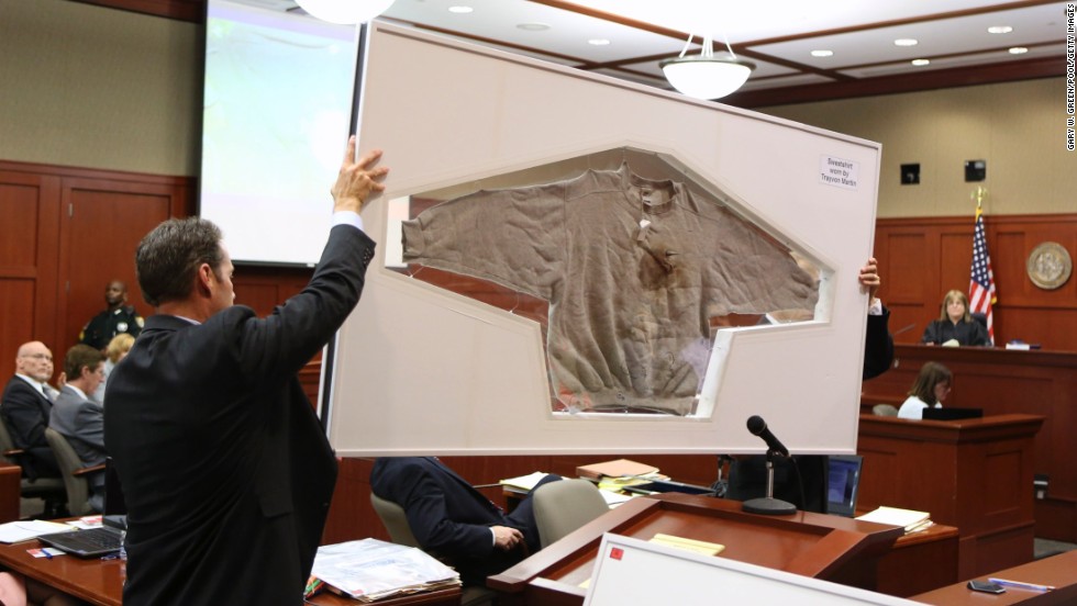 Assistant state attorneys John Guy, left, and Richard Mantei hold up Martin&#39;s sweatshirt as evidence during Zimmerman&#39;s trial on June 25. After Martin&#39;s death, &lt;a href=&quot;http://www.cnn.com/2012/03/27/living/history-hoodie-trayvon-martin/index.html&quot;&gt;protesters started wearing hoodies&lt;/a&gt; in solidarity against racial profiling.