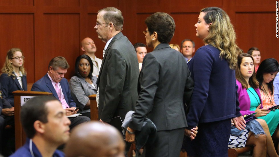 From left, Zimmerman&#39;s father, Robert Zimmerman Sr.; his mother, Gladys; and his wife, Shellie, are escorted from the courtroom on June 24. Since they are all on the witness list, the judge ruled they cannot be present in the courtroom until after they testify.