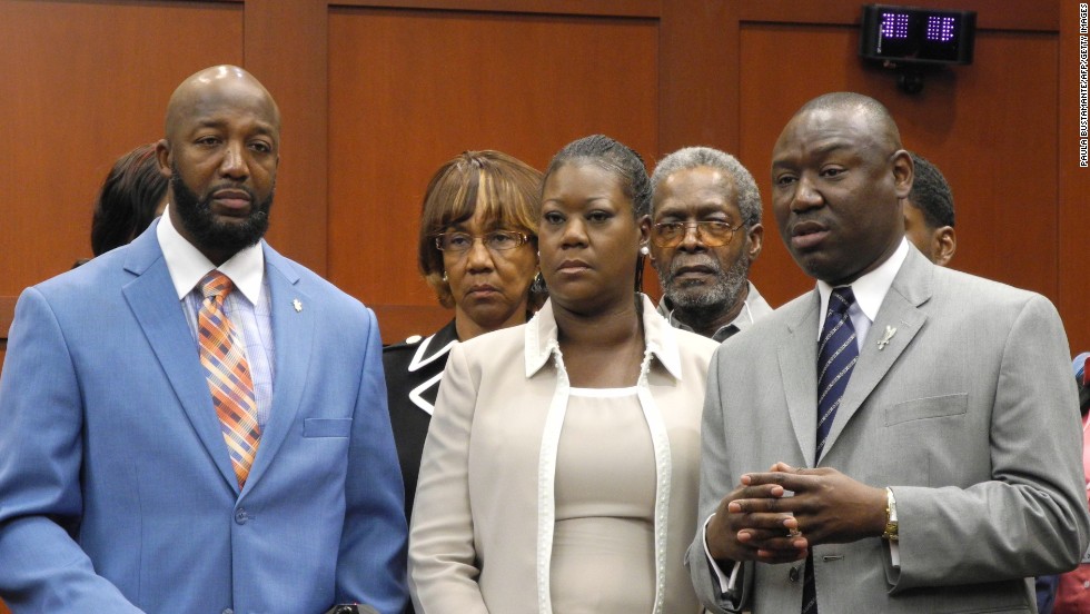 From left, Martin&#39;s parents, Tracy Martin and Sybrina Fulton, and Benjamin Crump, the family&#39;s legal counsel, make a brief statement to the media before jurors heard opening statements on June 24.